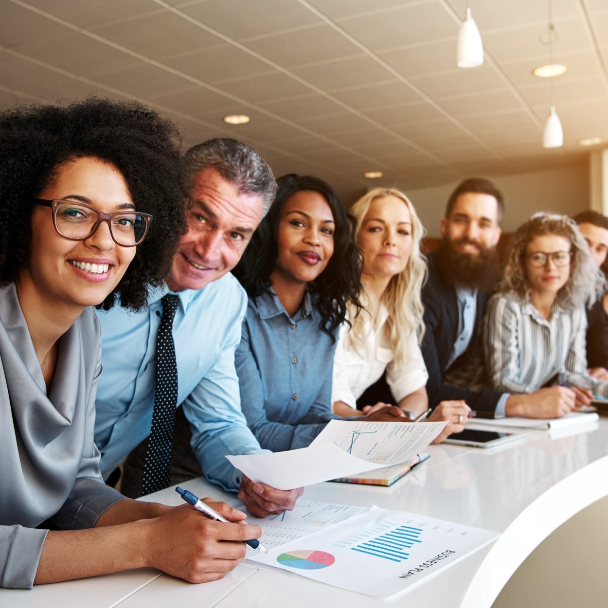 Smiling group of diverse colleagues working together in an office Yin and Yang: The Essential Balance in Modern Business
